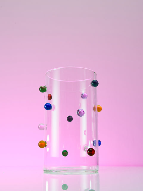 Dot Vase by Maison Balzac on a glowing purple background. 