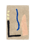 Beige bath mat with abstract colorful shapes on a white background