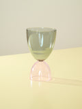A smoke top and pink bottom cocktail glass.