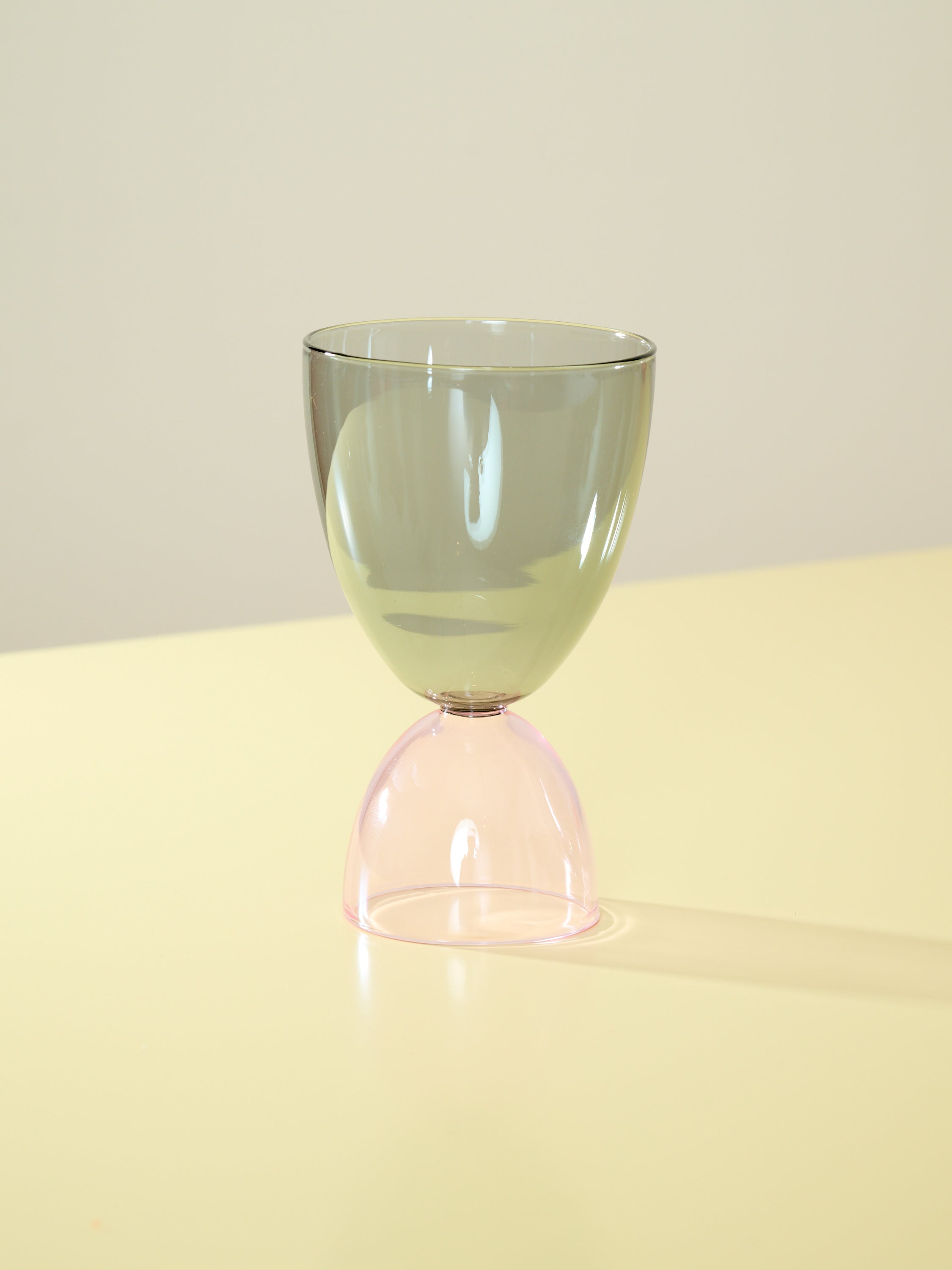A smoke top and pink bottom cocktail glass.