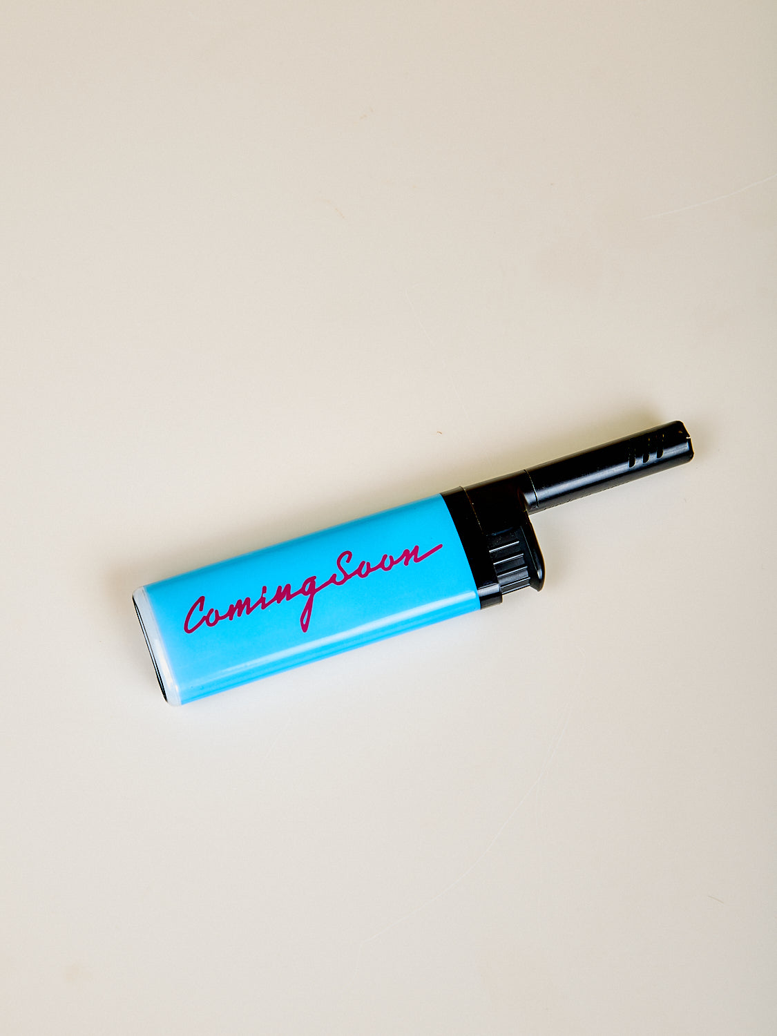 Bic EZ Reach lighter in blue with the Coming Soon logo.