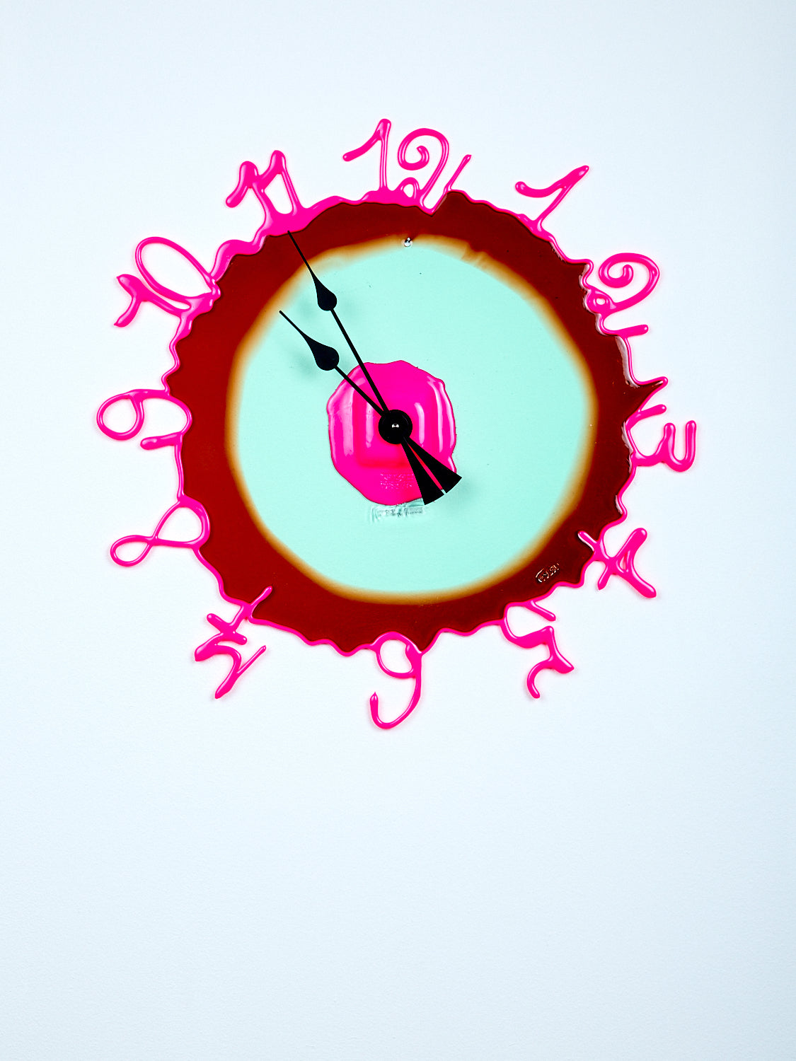 Abstract clock with pink numbers and brown border on white background