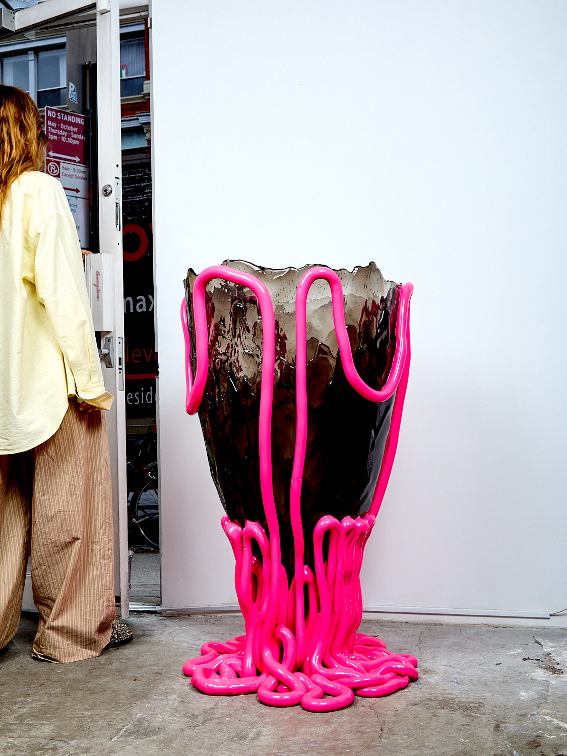 Large vase with pink liquid-like design on a white background
