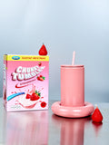 Pink 'Chunky Tumbler' with packaging and strawberries on a light blue background