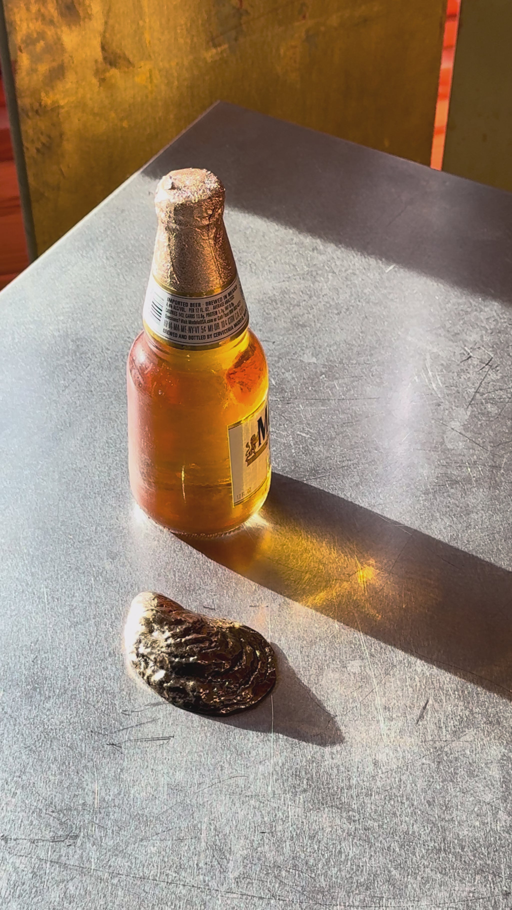 An oyster bottle opener in use.